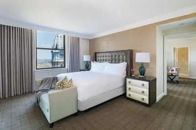 a bedroom with a large white bed and a window at The Ritz-Carlton, Philadelphia in Philadelphia
