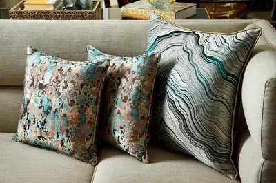a couch with three pillows on top of it at The Ritz-Carlton, Philadelphia in Philadelphia