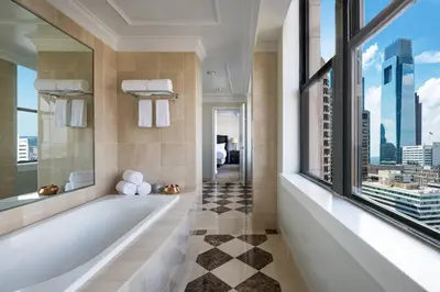 a bathroom with a bath tub and a window at The Ritz-Carlton, Philadelphia in Philadelphia