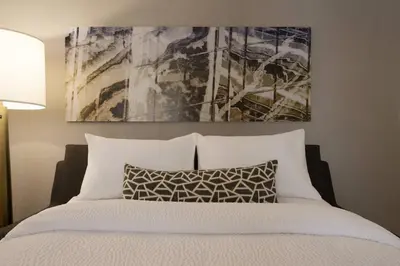 a bedroom with a bed and a painting on the wall at SpringHill Suites by Marriott Allentown Bethlehem/Center Valley in Center Valley