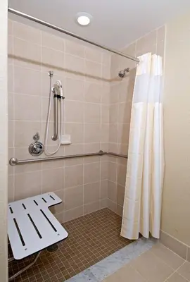 a bathroom with a shower with a shower curtain at Hilton Garden Inn Mount Holly/Westampton in Westampton Township