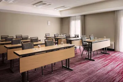 a large room with tables and chairs in it at Sonesta Select Whippany Hanover in Whippany