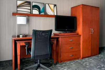 an office with a desk with a computer and a chair at Sonesta Select Whippany Hanover in Whippany