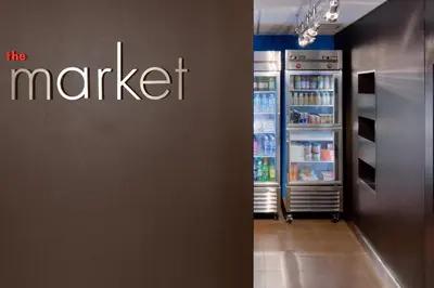 a large refrigerator with its door open in a store at Courtyard By Marriott Jersey City Newport in Jersey City