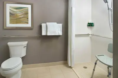 a bathroom with a toilet and a shower at Courtyard Philadelphia Devon/Villanova in Wayne