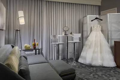 a wedding dress hanging in a living room at Courtyard Philadelphia Devon/Villanova in Wayne