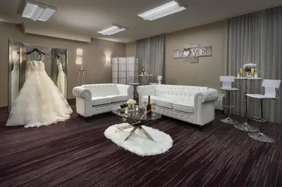 a dressing room with two couches and a wedding dress at Courtyard Philadelphia Devon/Villanova in Wayne