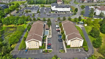 an aerial view of a parking lot with buildings at MainStay Suites Mt Laurel - Philadelphia in Mount Laurel