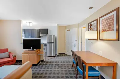 a living room with a kitchen and a dining room at MainStay Suites Mt Laurel - Philadelphia in Mount Laurel