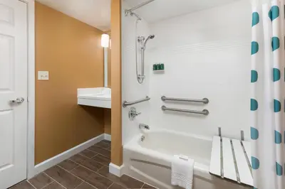 a bathroom with a tub and a sink at MainStay Suites Mt Laurel - Philadelphia in Mount Laurel