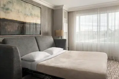 a hotel room with a bed and a window at Marriott Philadelphia West in West Conshohocken