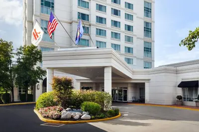 a hotel building with flags in front of it at Marriott Philadelphia West in West Conshohocken