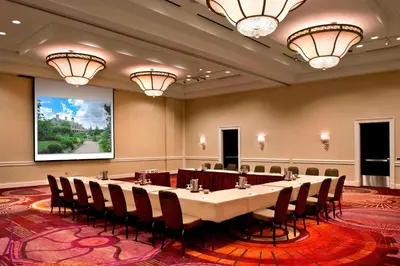 a conference room with a long table and chairs at Marriott Philadelphia West in West Conshohocken