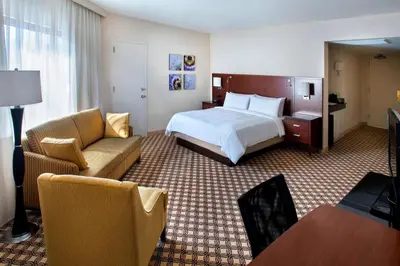 a hotel room with a bed and a couch at Princeton Marriott at Forrestal in Princeton