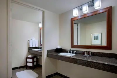 a bathroom with a sink and a mirror at Princeton Marriott at Forrestal in Princeton