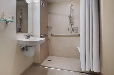 a bathroom with a sink and a shower at Princeton Marriott at Forrestal in Princeton