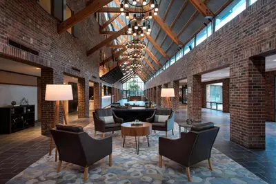 a lobby with chairs and a couch and a table at Princeton Marriott at Forrestal in Princeton