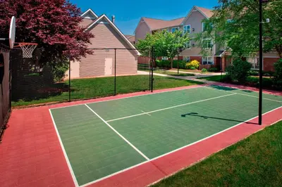 a tennis court in front of a house at Sonesta ES Suites Allentown Bethlehem Airport in Bethlehem
