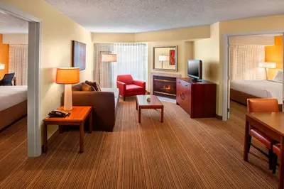 a hotel room with a bed and a living room at Sonesta ES Suites Allentown Bethlehem Airport in Bethlehem