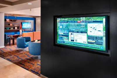 a television hanging on a wall in a room at Courtyard Parsippany in Parsippany
