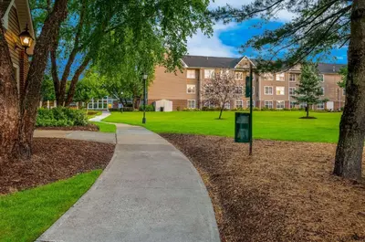 a walkway through a park in front of a building at Sonesta ES Suites Parsippany Morris Plains in Parsippany