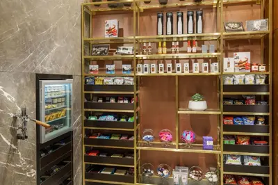 a shelf full of products in a room at AC Hotel by Marriott New York Times Square in New York