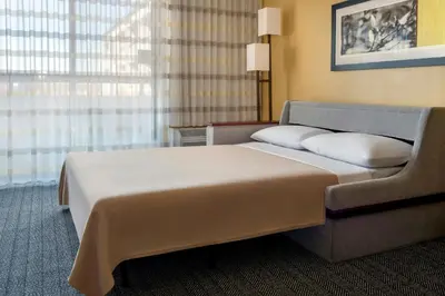 a hotel room with a bed and a window at Courtyard by Marriott Mt. Laurel in Mount Laurel