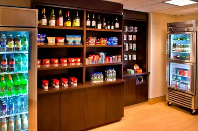 a store with a refrigerator and shelves full of drinks at SpringHill Suites Philadelphia Plymouth Meeting in Plymouth Meeting