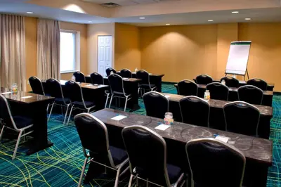 a conference room with tables and chairs in it at SpringHill Suites Philadelphia Plymouth Meeting in Plymouth Meeting