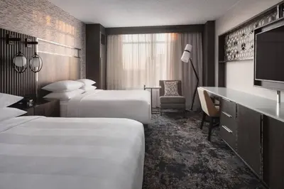 a hotel room with two beds and a television at Bridgewater Marriott in Bridgewater