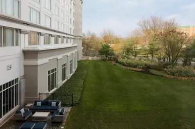 a view of a yard next to a building at Bridgewater Marriott in Bridgewater
