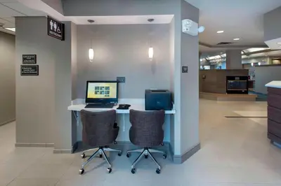 an office with a desk with a computer and two chairs at Residence Inn by Marriott Somerset in Somerset