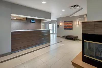 a lobby of a hospital with a fireplace at Residence Inn by Marriott Somerset in Somerset