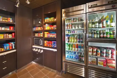 a refrigerator filled with lots of different types of drinks at Courtyard by Marriott Basking Ridge in Basking Ridge
