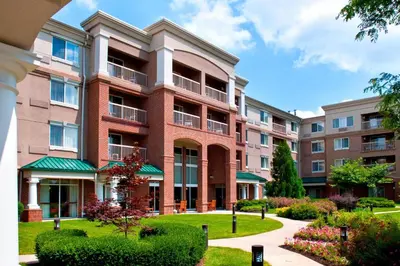 an apartment building with a walkway in front of it at Courtyard by Marriott Basking Ridge in Basking Ridge