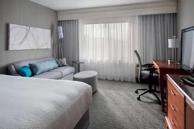 a hotel room with a bed and a desk at Courtyard by Marriott Lebanon in Lebanon