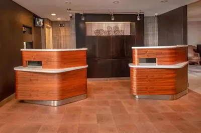a room with two wooden counters in a room at Courtyard Wilmington Downtown in Wilmington