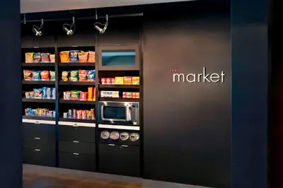 a store with a market sign on a wall at Sonesta Select Newark Christiana Mall in Newark
