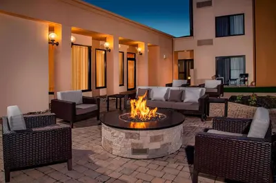 a patio with a fire pit in the middle at Sonesta Select Newark Christiana Mall in Newark