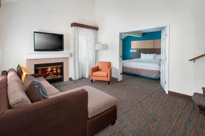 a hotel room with a couch and a fireplace at Residence Inn Philadelphia Valley Forge in Berwyn