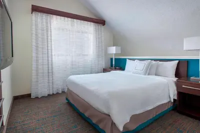 a bedroom with a large white bed and a window at Residence Inn Philadelphia Valley Forge in Berwyn