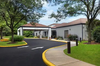 a road in front of a building with a driveway at Courtyard Philadelphia Valley Forge / King of Prussia in Wayne