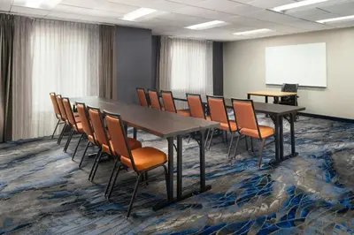 a conference room with a long table and chairs at Fairfield Inn & Suites by Marriott Newark Liberty International Airport in Newark