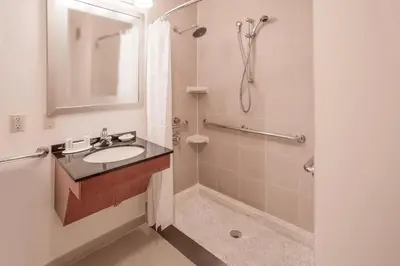 a bathroom with a sink and a shower at Residence Inn by Marriott New York Manhattan/Times Square in New York