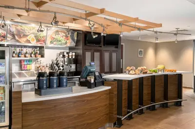 a fast food restaurant with a counter with food at Courtyard Philadelphia Valley Forge Collegeville in Collegeville