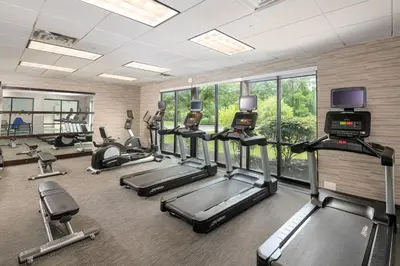 a gym with several treadmills and elliptical machines at Courtyard Philadelphia Valley Forge Collegeville in Collegeville