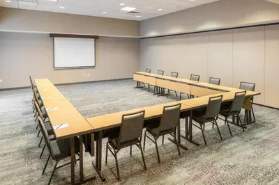 a conference room with a long table and chairs at Courtyard Philadelphia Valley Forge Collegeville in Collegeville