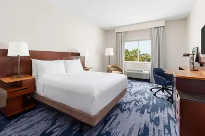 a hotel room with a bed and a desk at Fairfield Inn Philadelphia Airport in Philadelphia