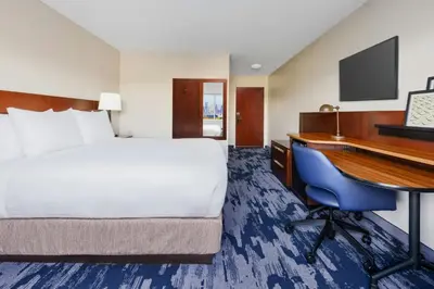 a hotel room with a bed and a desk at Fairfield Inn Philadelphia Airport in Philadelphia