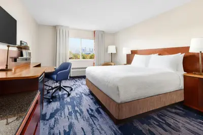 a hotel room with a bed and a desk at Fairfield Inn Philadelphia Airport in Philadelphia